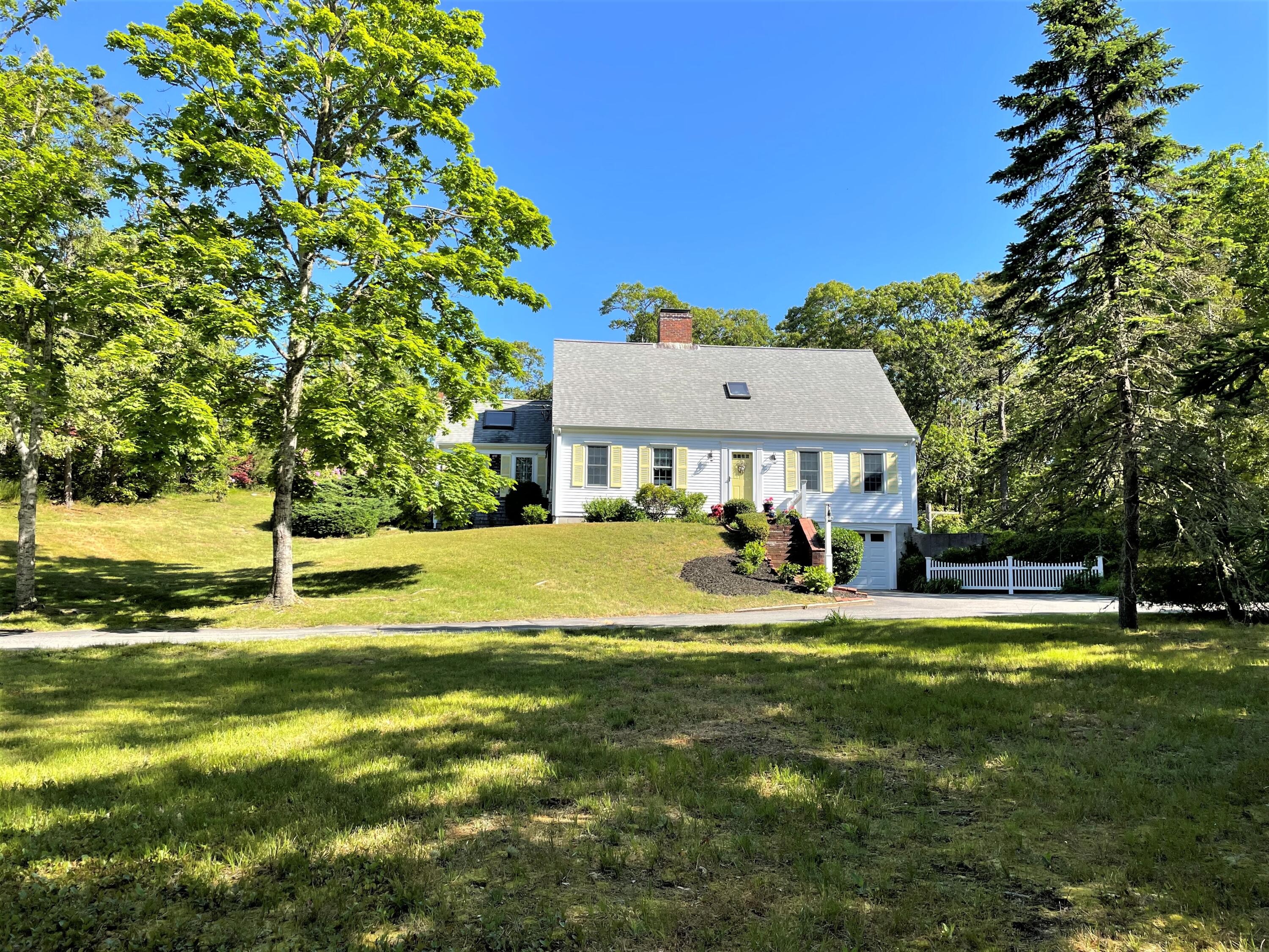 144 Long Road Harwich, MA 02645 - Photo 3 of 49 a view of a house with a big yard and sitting area