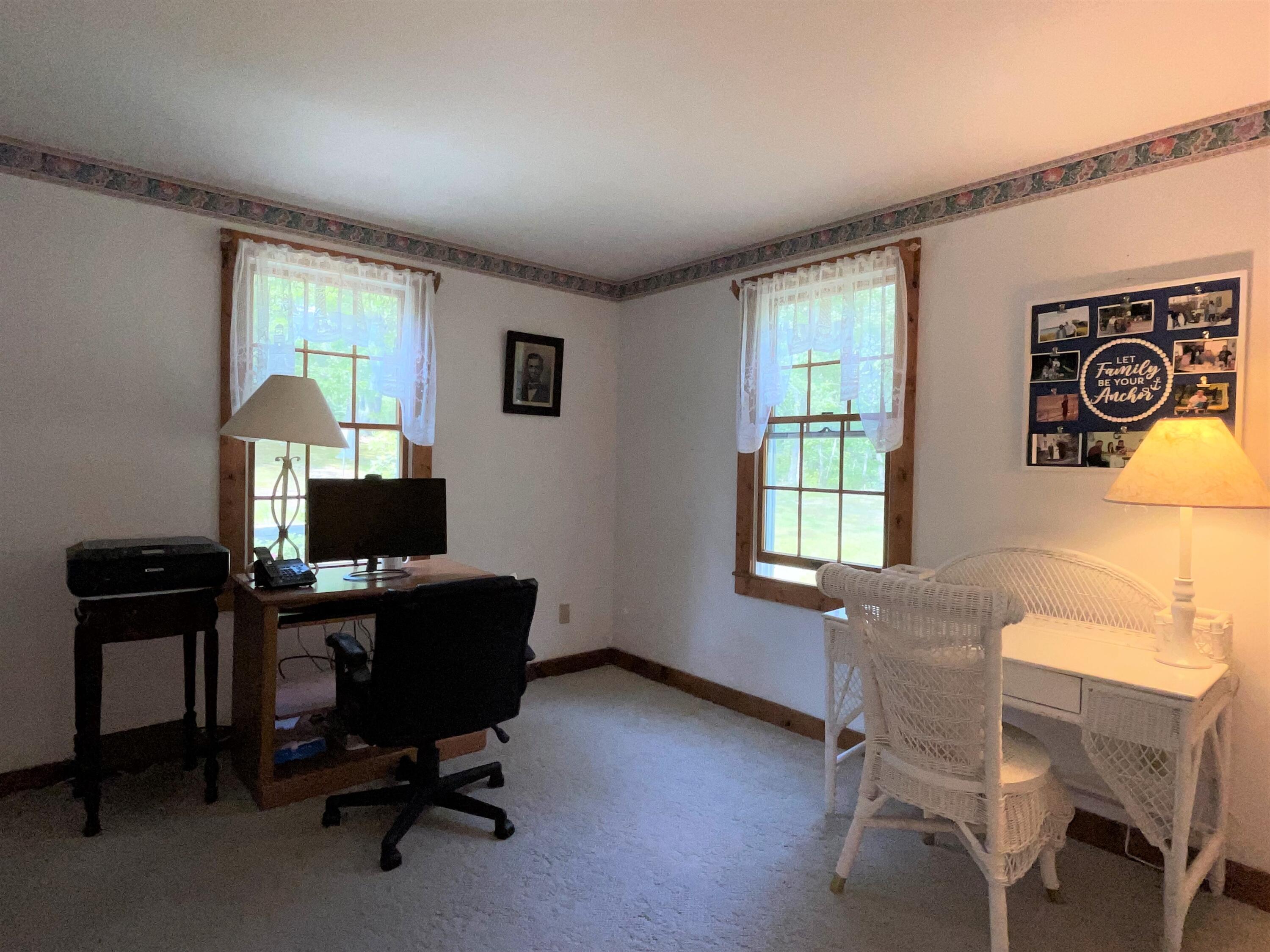 144 Long Road Harwich, MA 02645 - Photo 32 of 49 a view of a workspace with furniture and a window