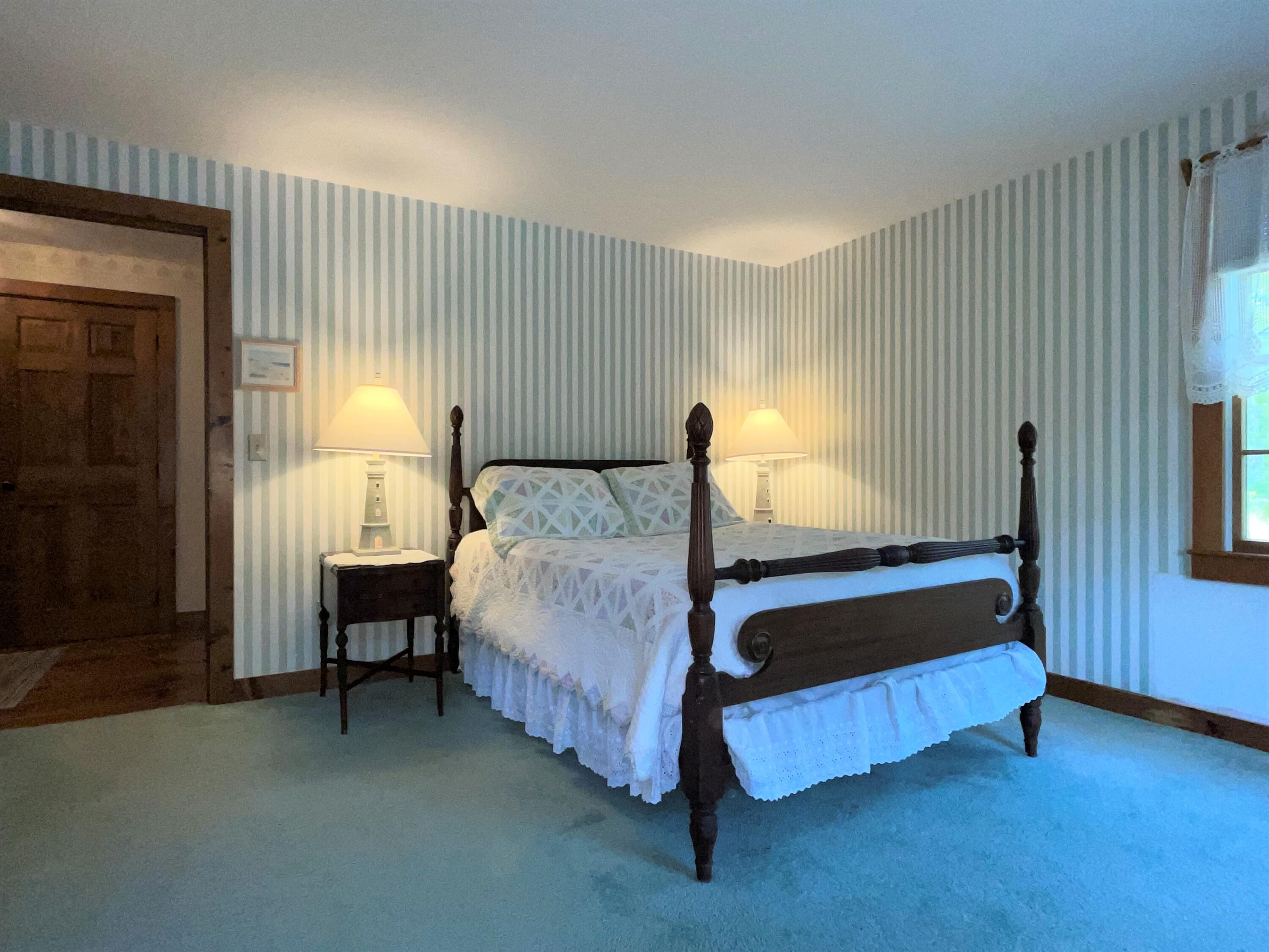 144 Long Road Harwich, MA 02645 - Photo 33 of 49 a spacious bedroom with a bed and a window