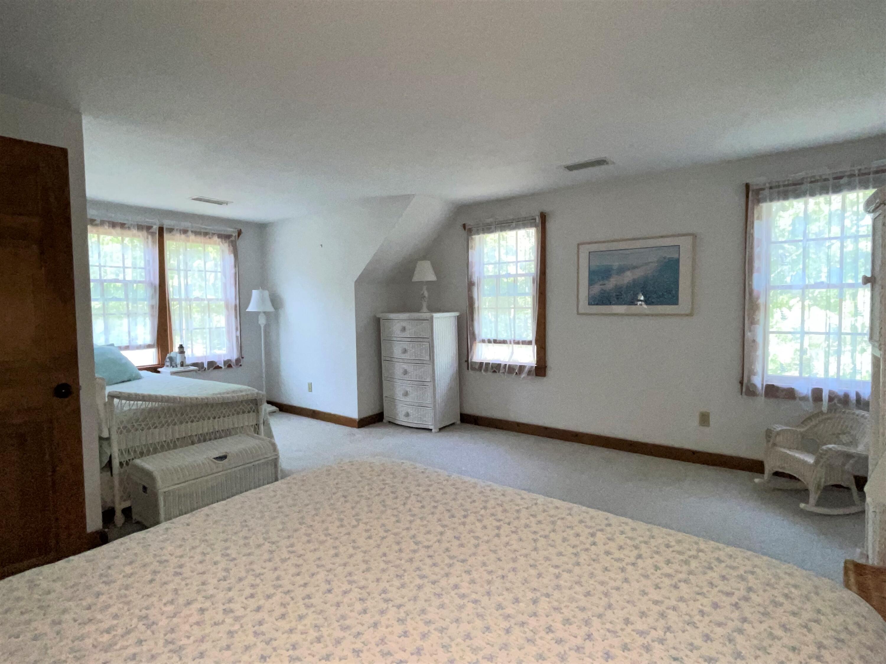 144 Long Road Harwich, MA 02645 - Photo 37 of 49 a room with a bed and windows