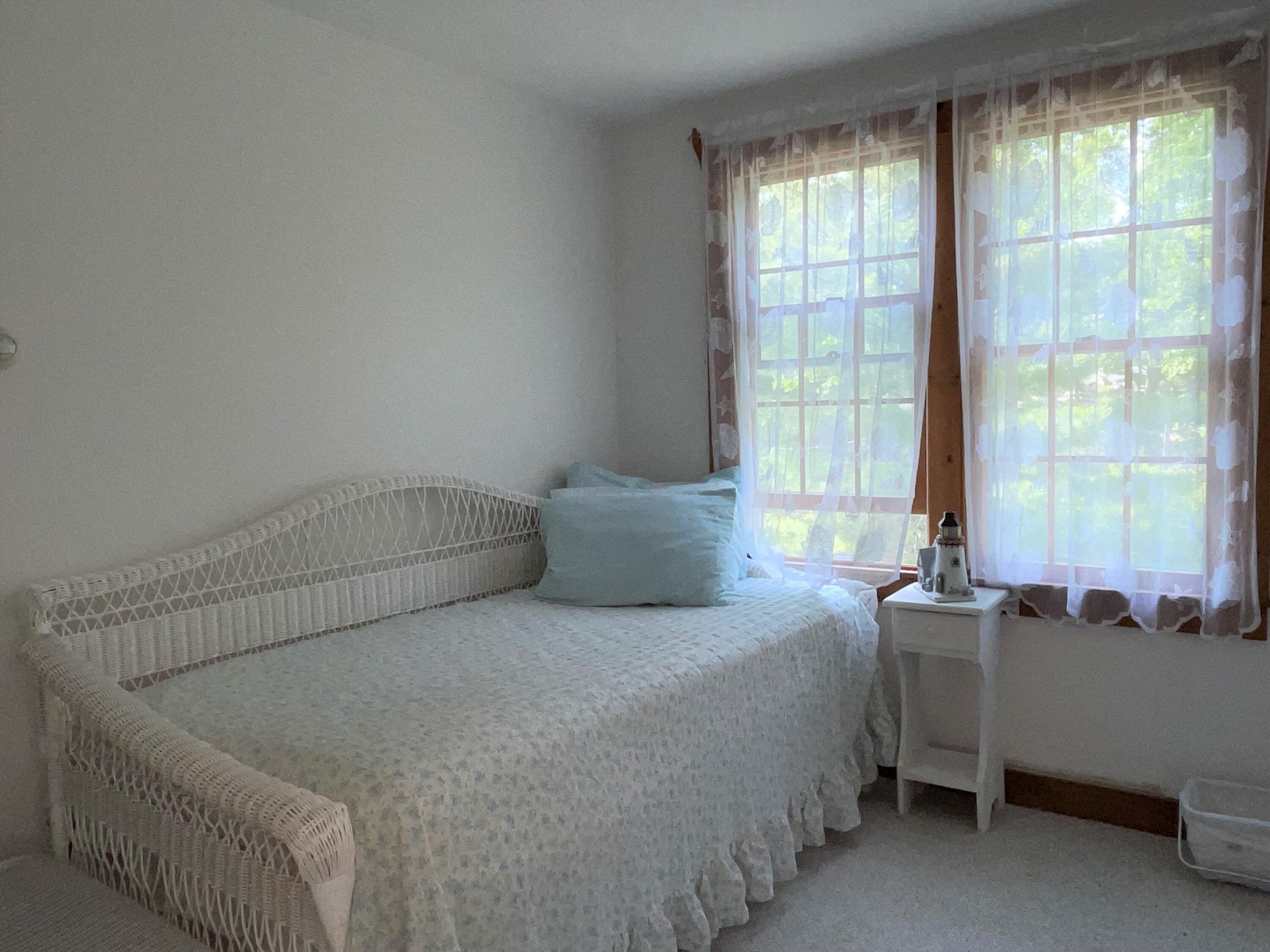 144 Long Road Harwich, MA 02645 - Photo 38 of 49 a bedroom with a bed and a window