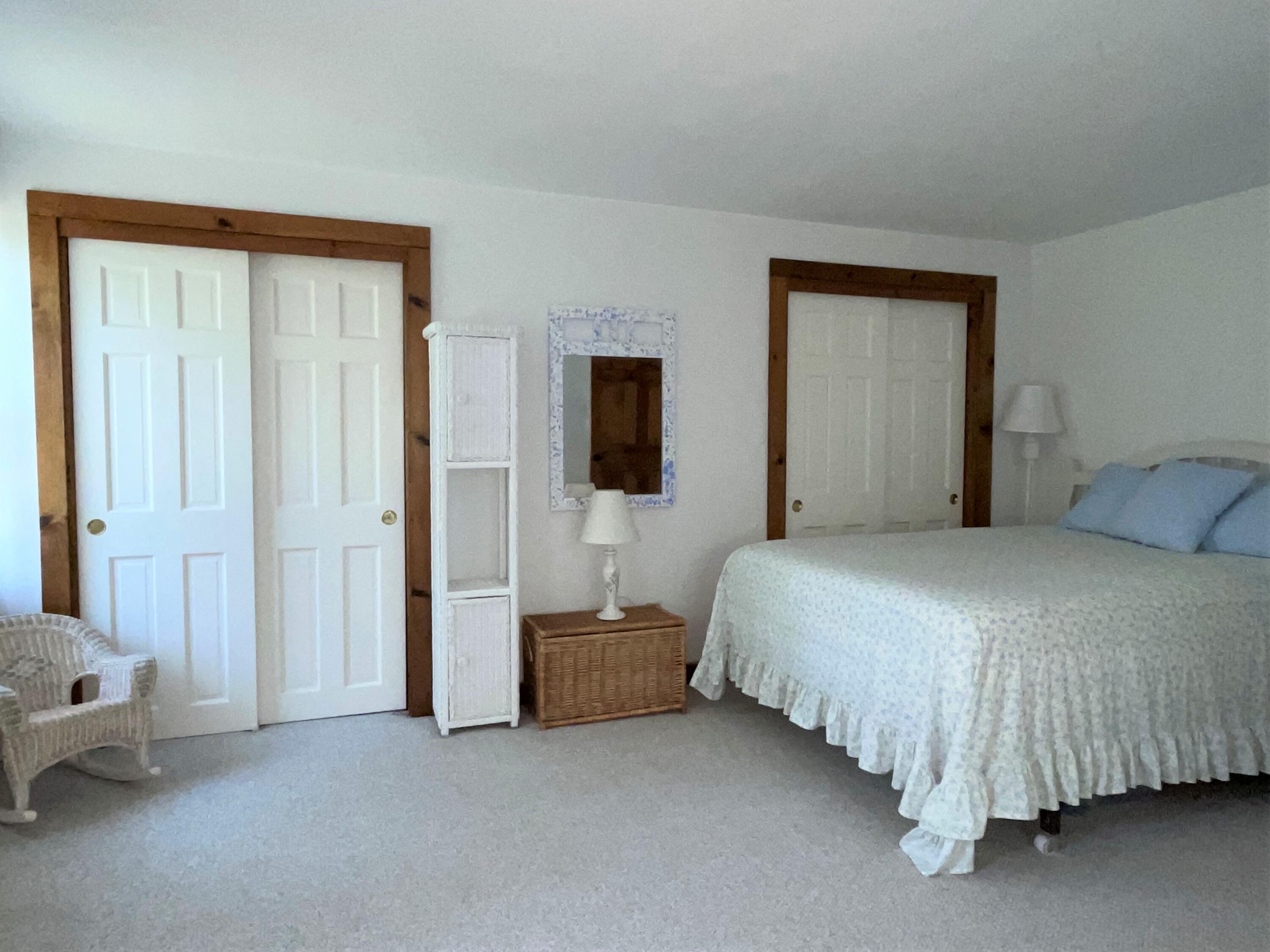 144 Long Road Harwich, MA 02645 - Photo 39 of 49 a bedroom with a bed and lamp