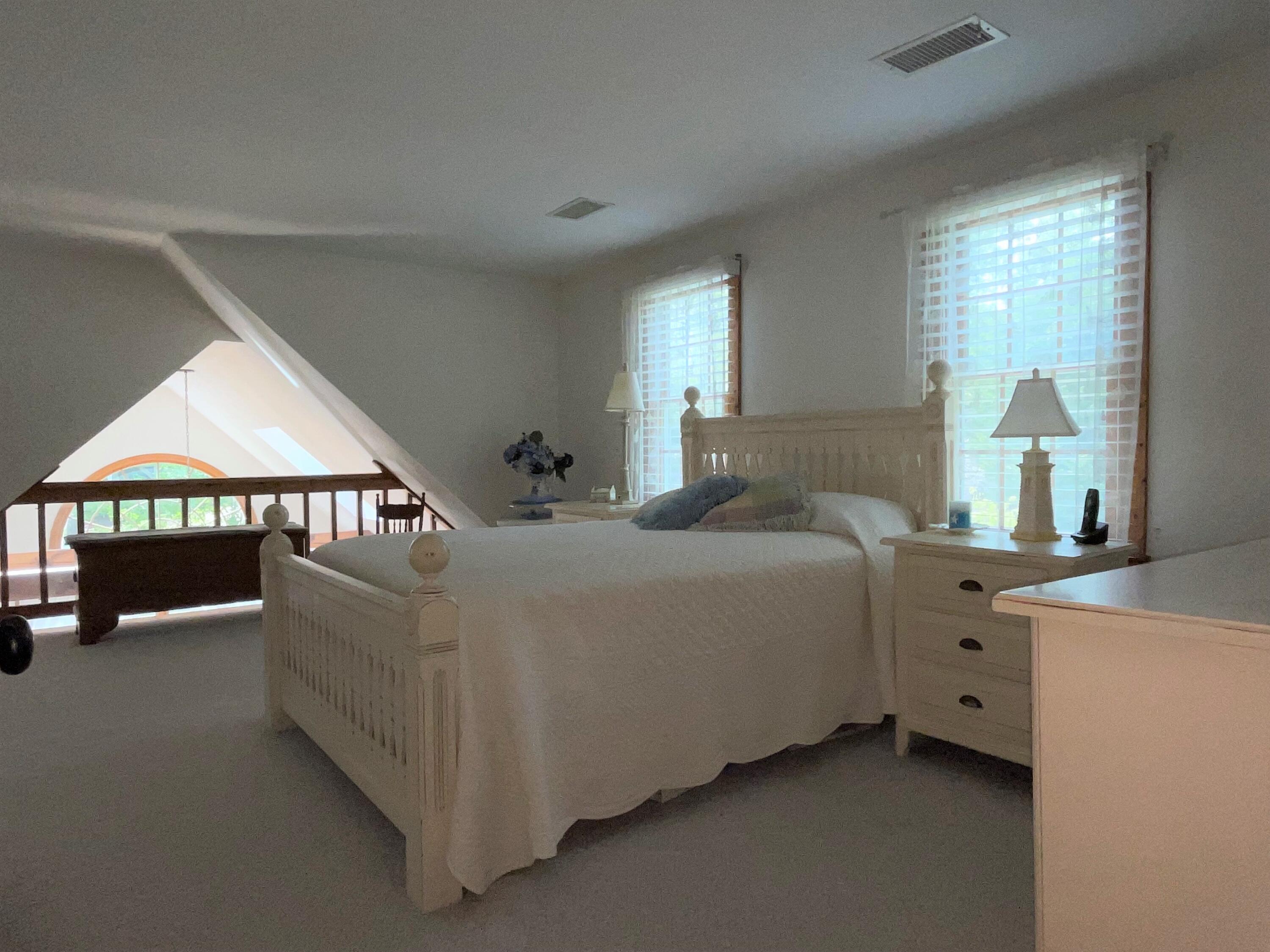 144 Long Road Harwich, MA 02645 - Photo 41 of 49 a bedroom with a bed and a large window