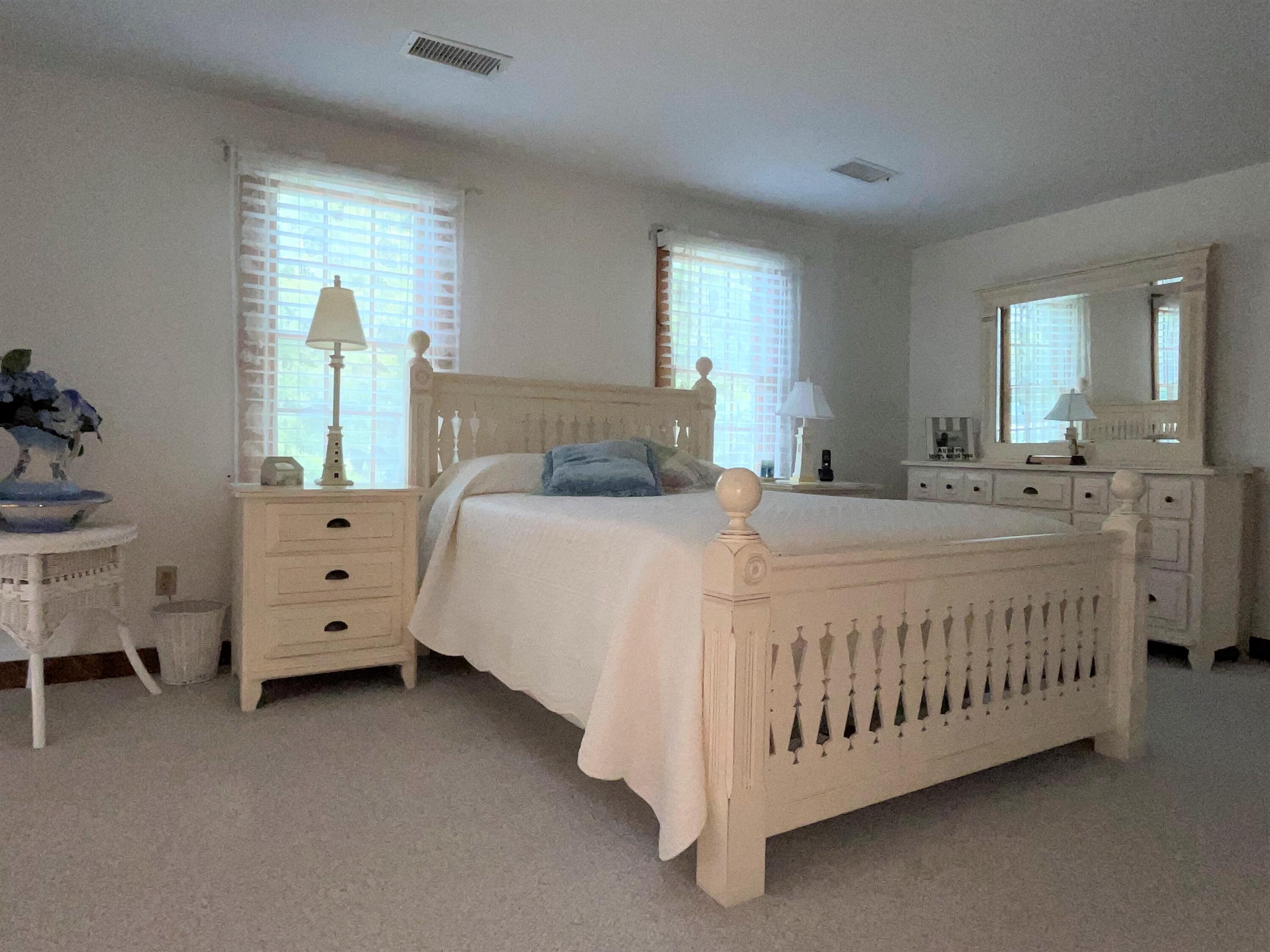 144 Long Road Harwich, MA 02645 - Photo 46 of 49 a bedroom with a bed and a window