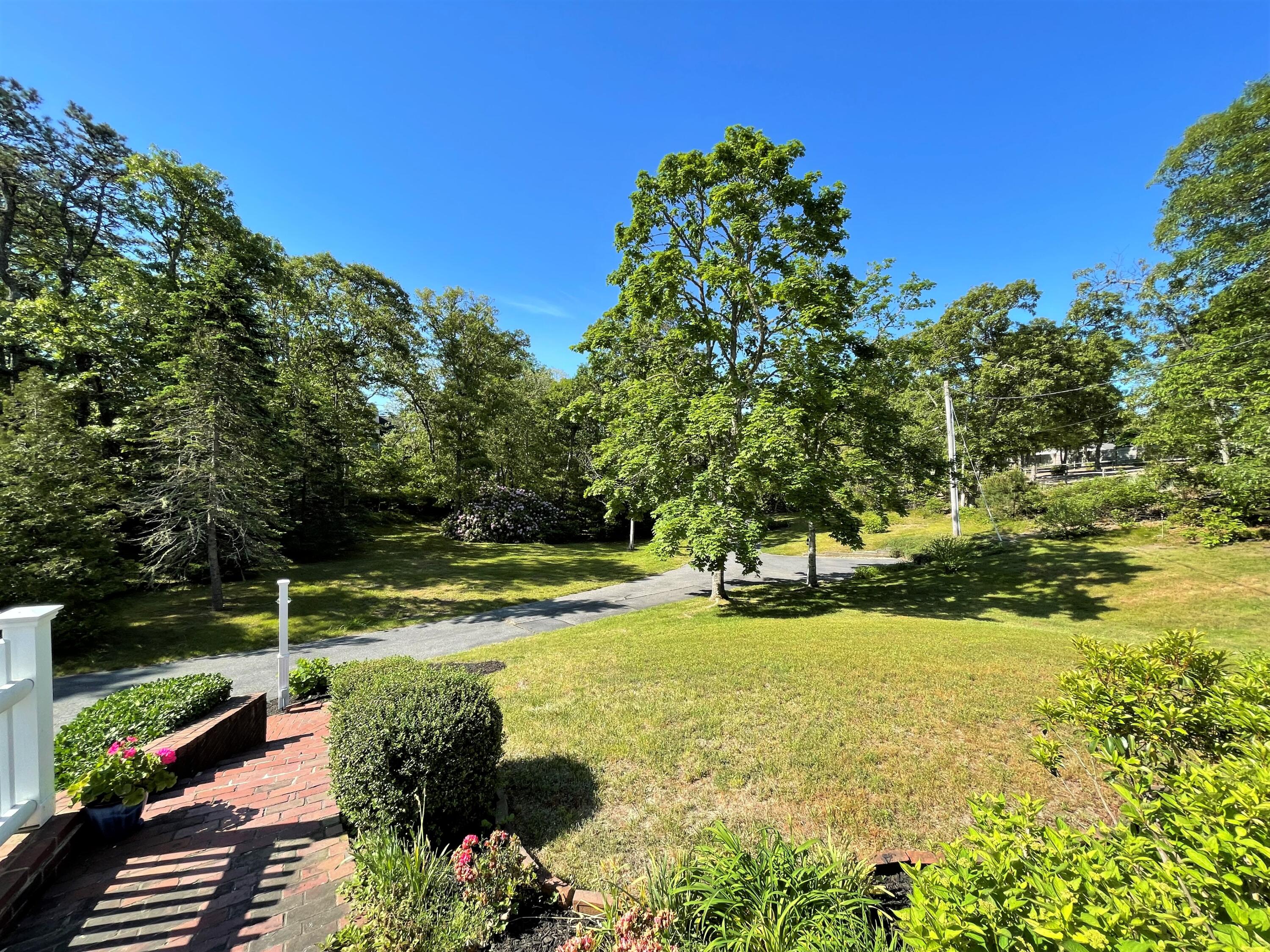 144 Long Road Harwich, MA 02645 - Photo 5 of 49 a view of a garden with an ocean