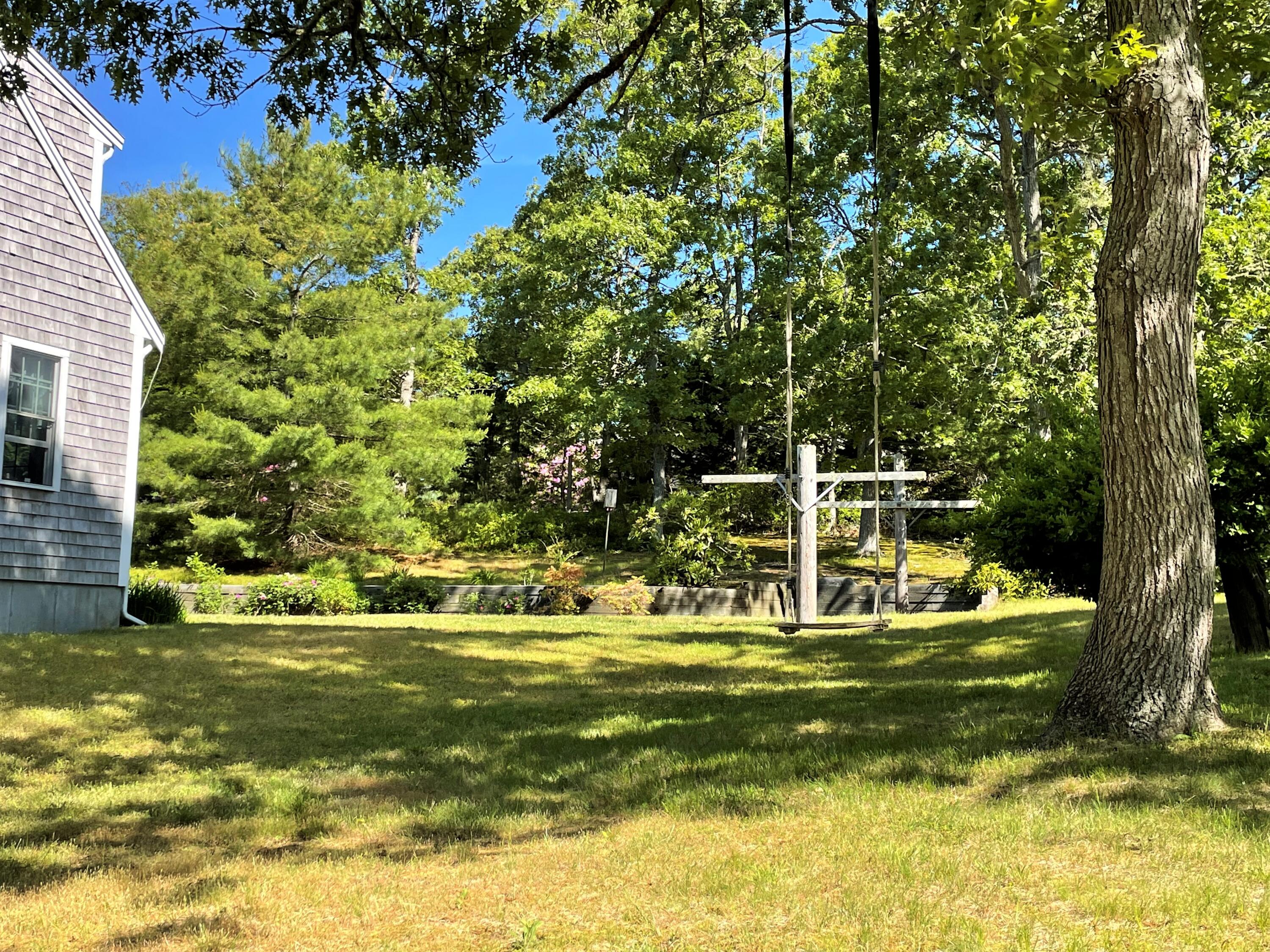 144 Long Road Harwich, MA 02645 - Photo 6 of 49 a view of a house with swimming pool