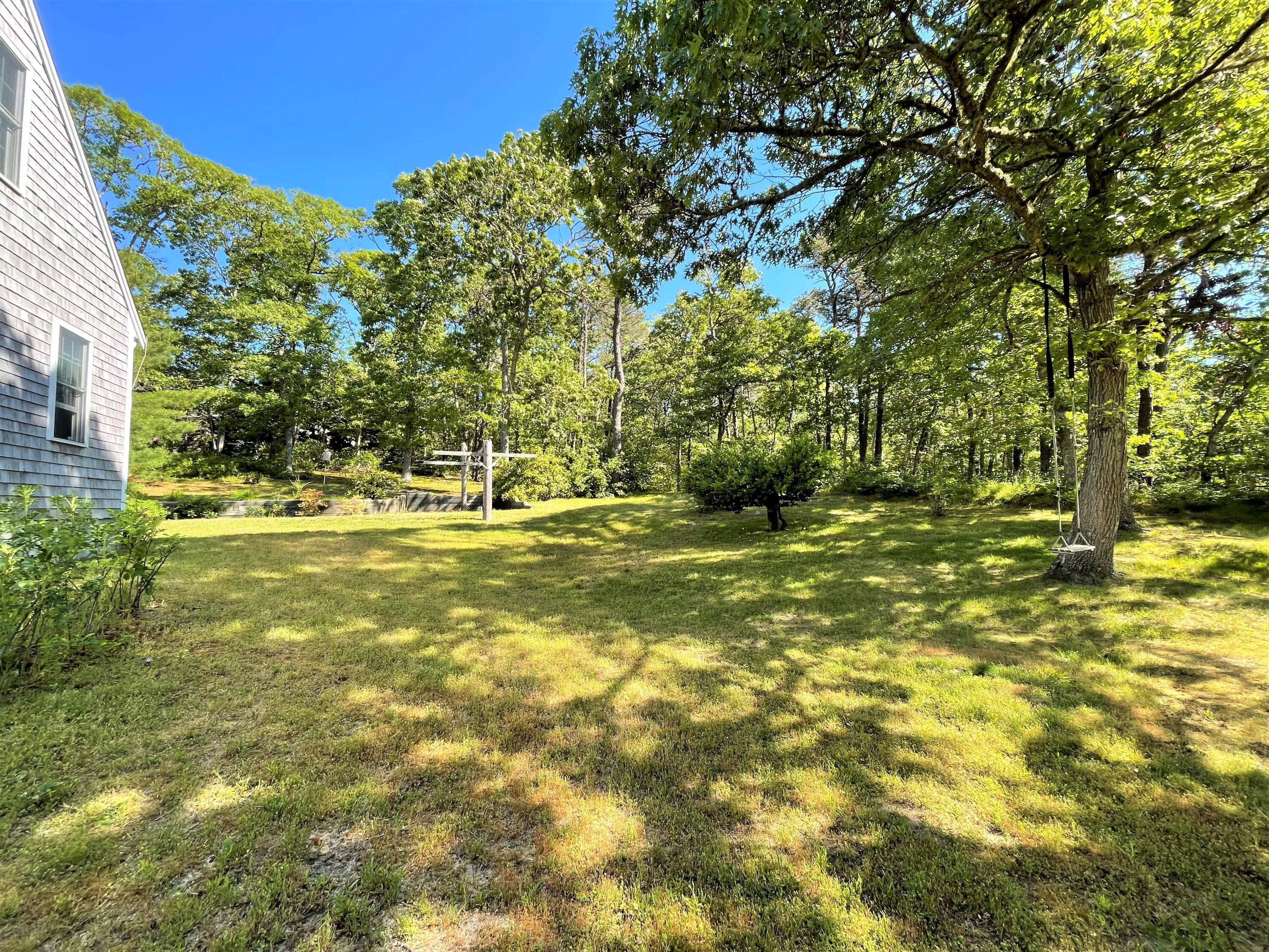144 Long Road Harwich, MA 02645 - Photo 8 of 49 a view of yard with swimming pool and green space