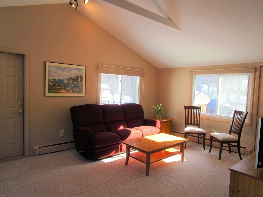 25 Lyndon Road Sharon, MA 02067 - Photo 1 of 27 a living room with furniture a large window and a lamp