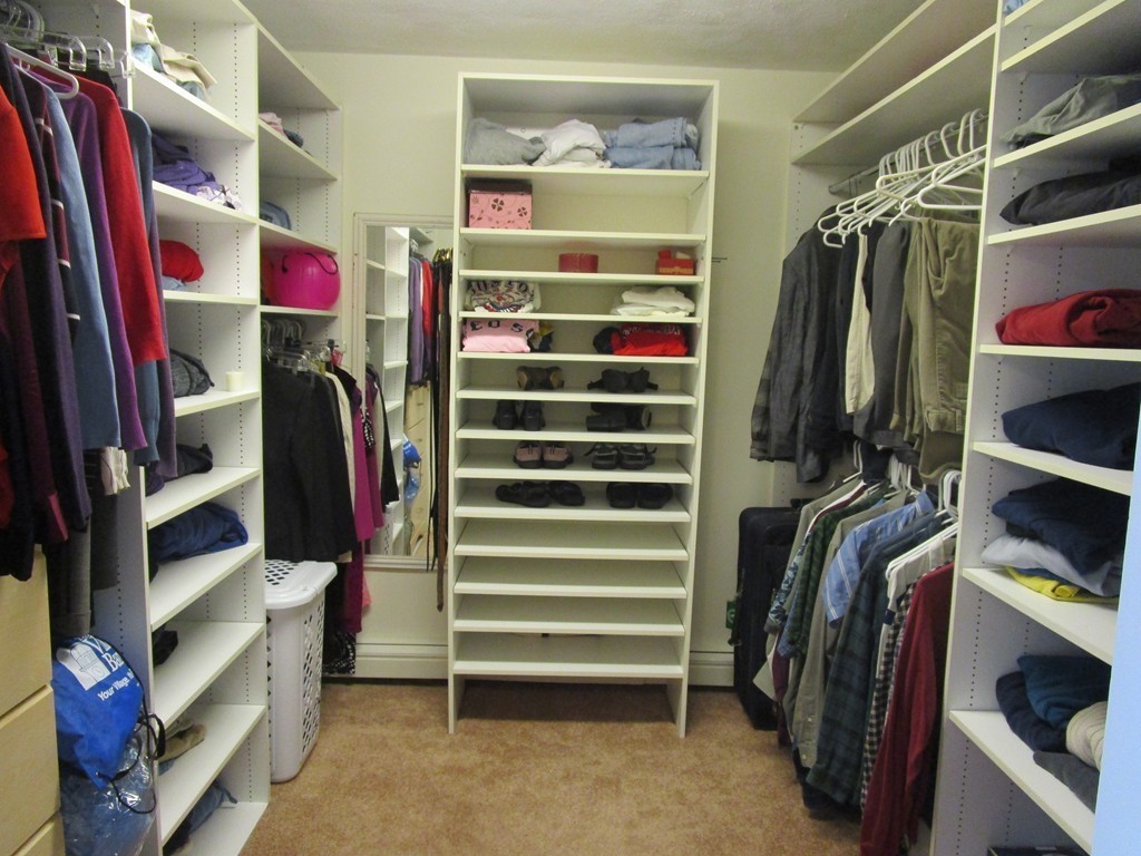 25 Lyndon Road Sharon, MA 02067 - Photo 13 of 27 a view of walk in closet with clothes and shoes