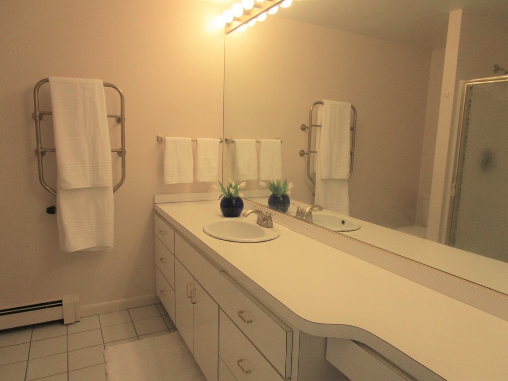 25 Lyndon Road Sharon, MA 02067 - Photo 14 of 27 a bathroom with a sink and mirror