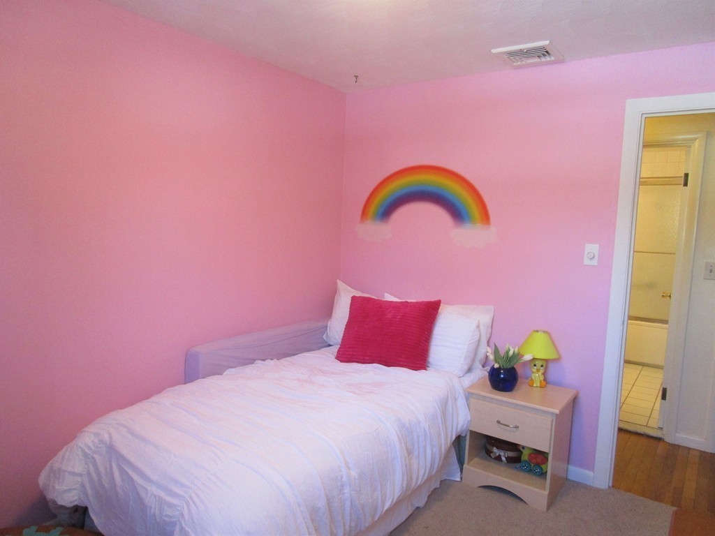 25 Lyndon Road Sharon, MA 02067 - Photo 16 of 27 a bedroom with a bed and a dresser