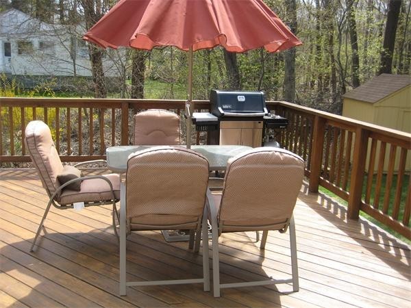 25 Lyndon Road Sharon, MA 02067 - Photo 21 of 27 a view of balcony with outdoor seating and wooden floor