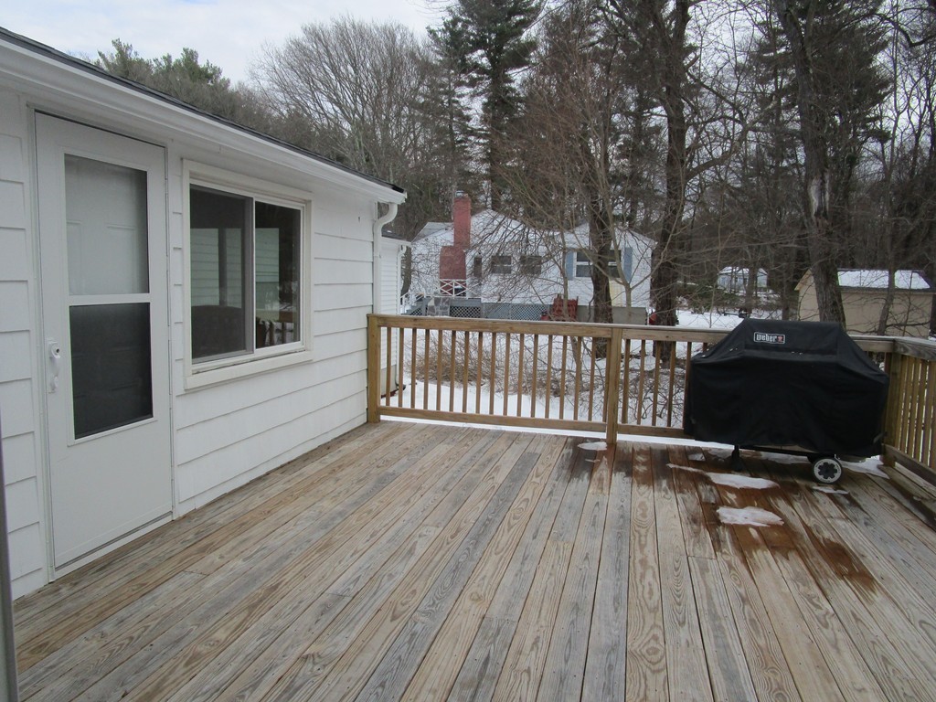 25 Lyndon Road Sharon, MA 02067 - Photo 24 of 27 a view of a roof deck with wooden floor and fence