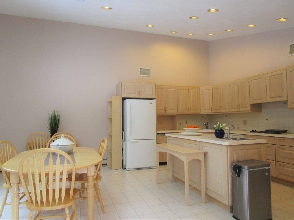 25 Lyndon Road Sharon, MA 02067 - Photo 6 of 27 a kitchen with a sink a refrigerator and a stove