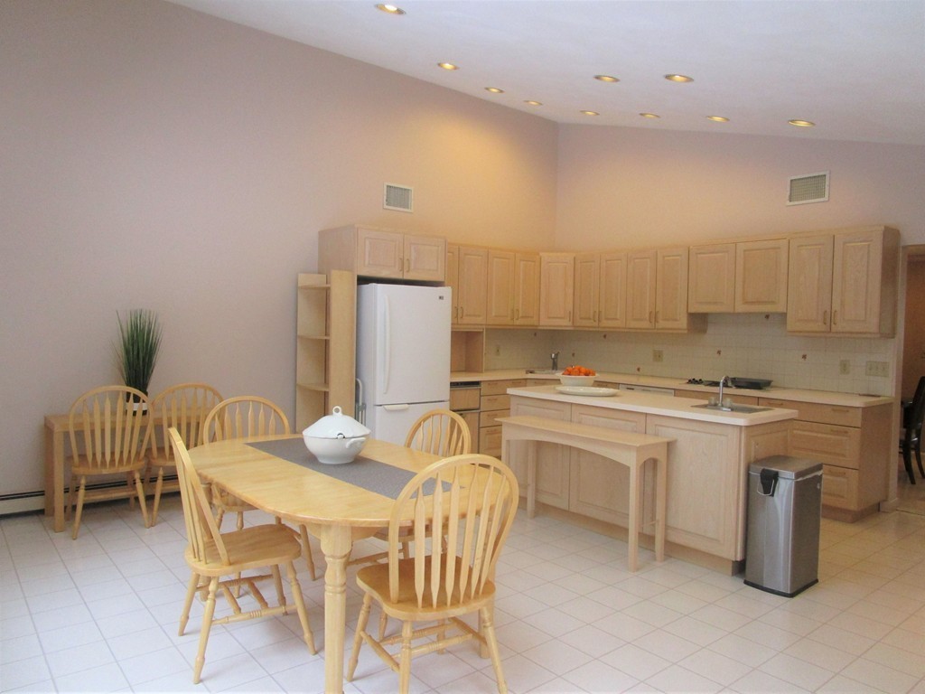 25 Lyndon Road Sharon, MA 02067 - Photo 7 of 27 a kitchen with a sink cabinets and appliances