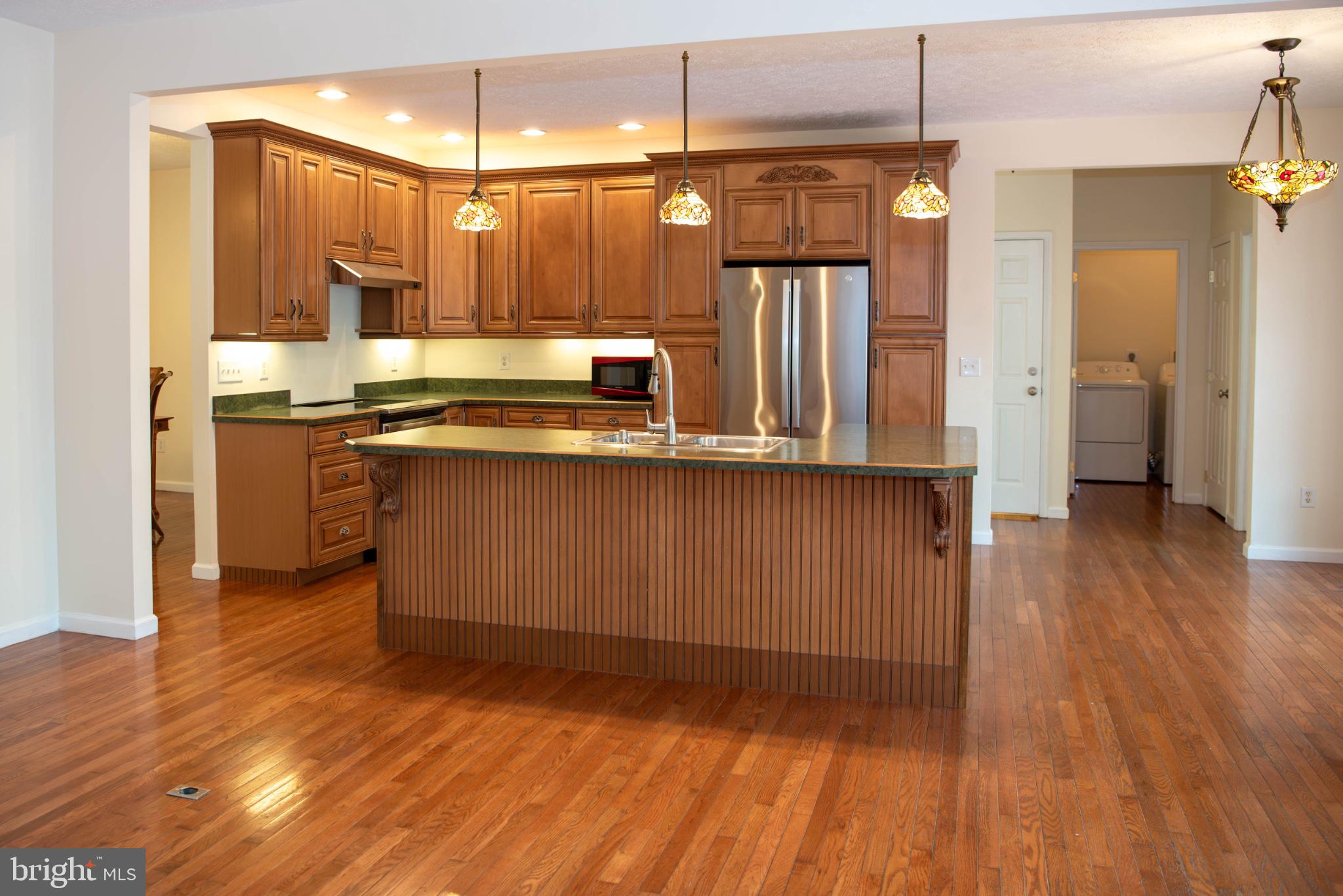 792 Forest Glen Road Moorefield, WV 26836 - Photo 35 of 146 Warm wood tones in a spacious kitchen.