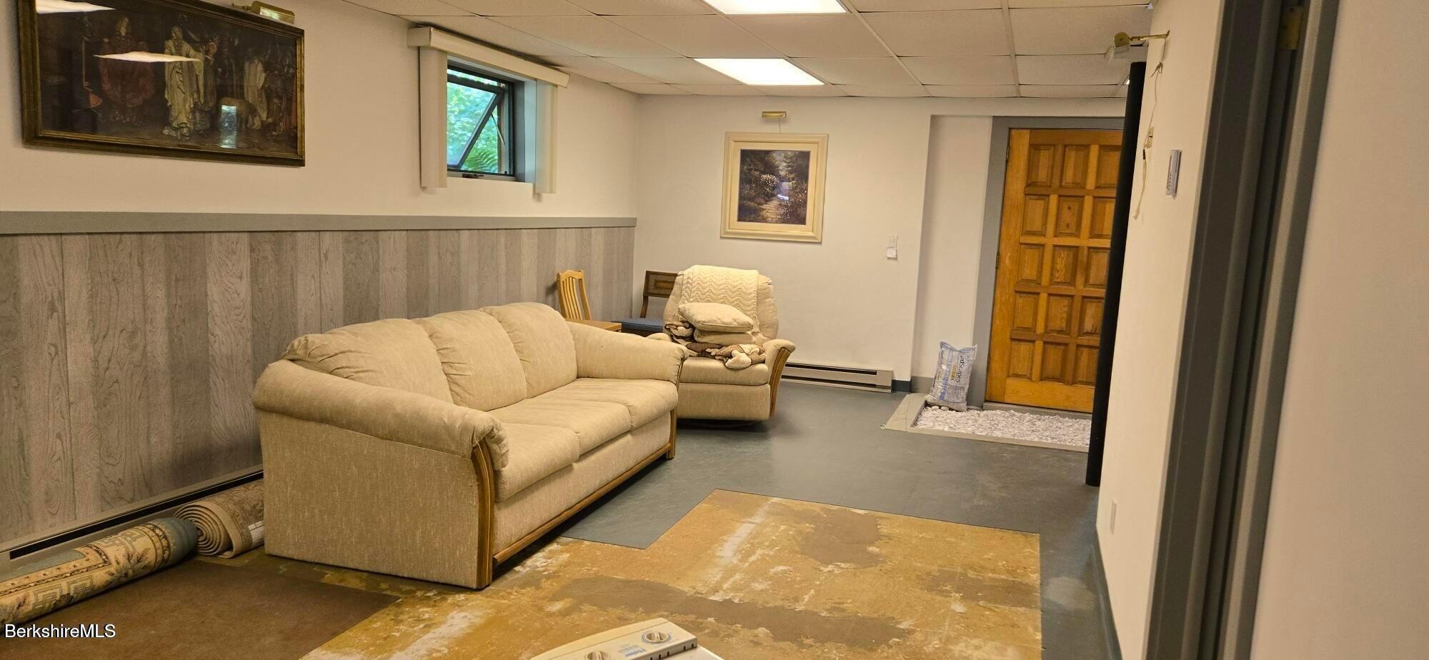 364 Otis Road Becket, MA 01223 - Photo 6 of 8 a living room with furniture and a window