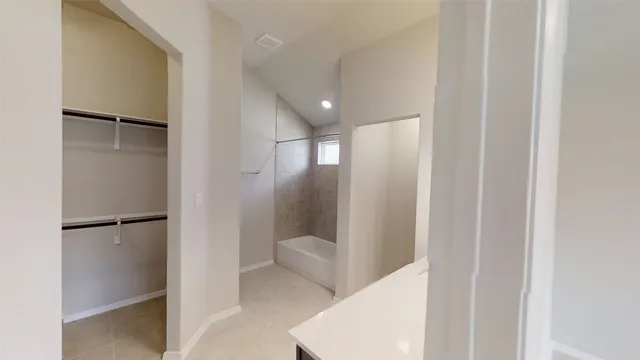 a bathroom with a bathtub and a sink