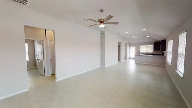 a view of a hallway with a kitchen