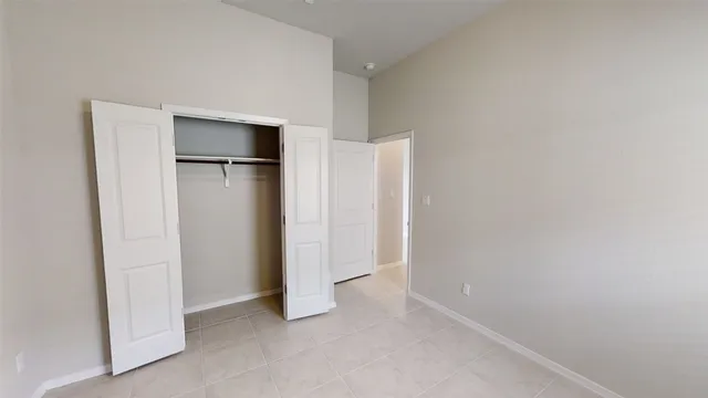 a view of empty room with closet