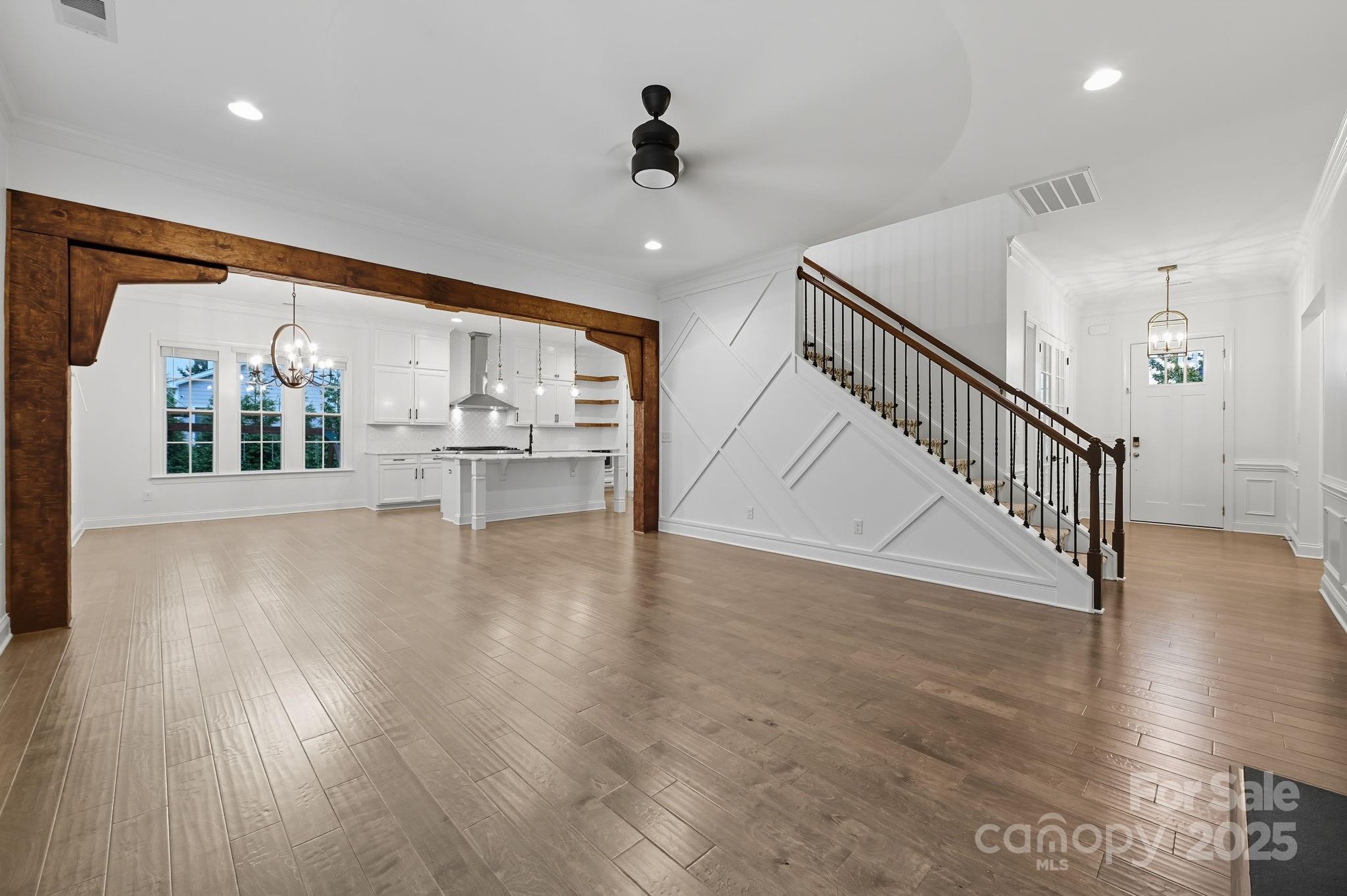 425 Cassia Court Tega Cay, SC 29708 - Photo 13 of 39 a view of an entryway with wooden floor