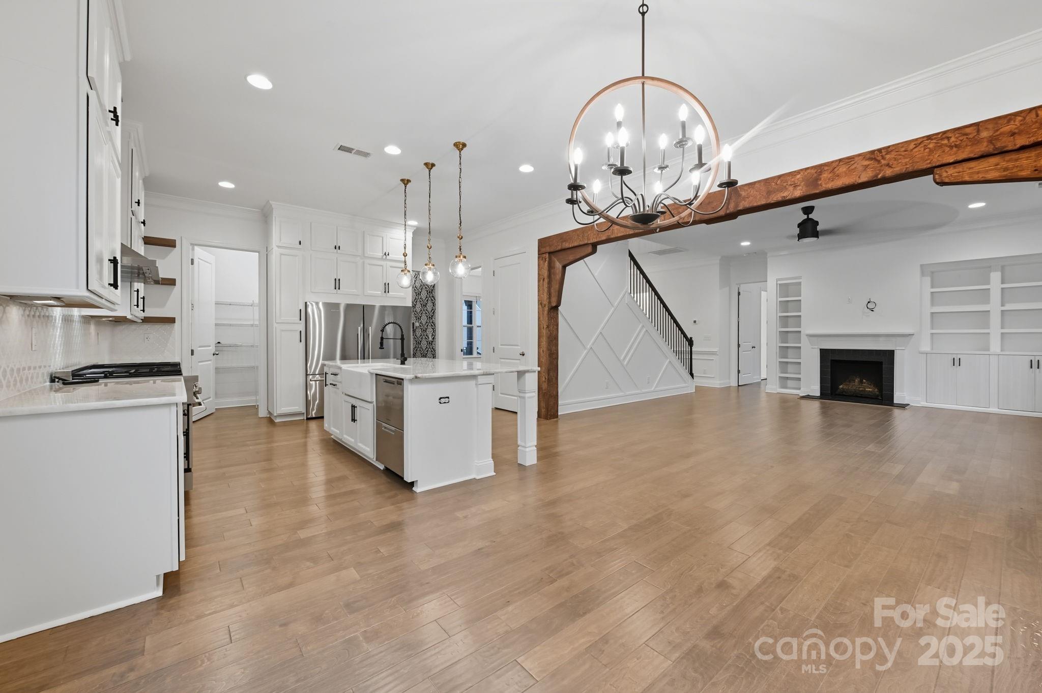 425 Cassia Court Tega Cay, SC 29708 - Photo 28 of 39 a view of kitchen and kitchen with stainless steel appliances wooden floor