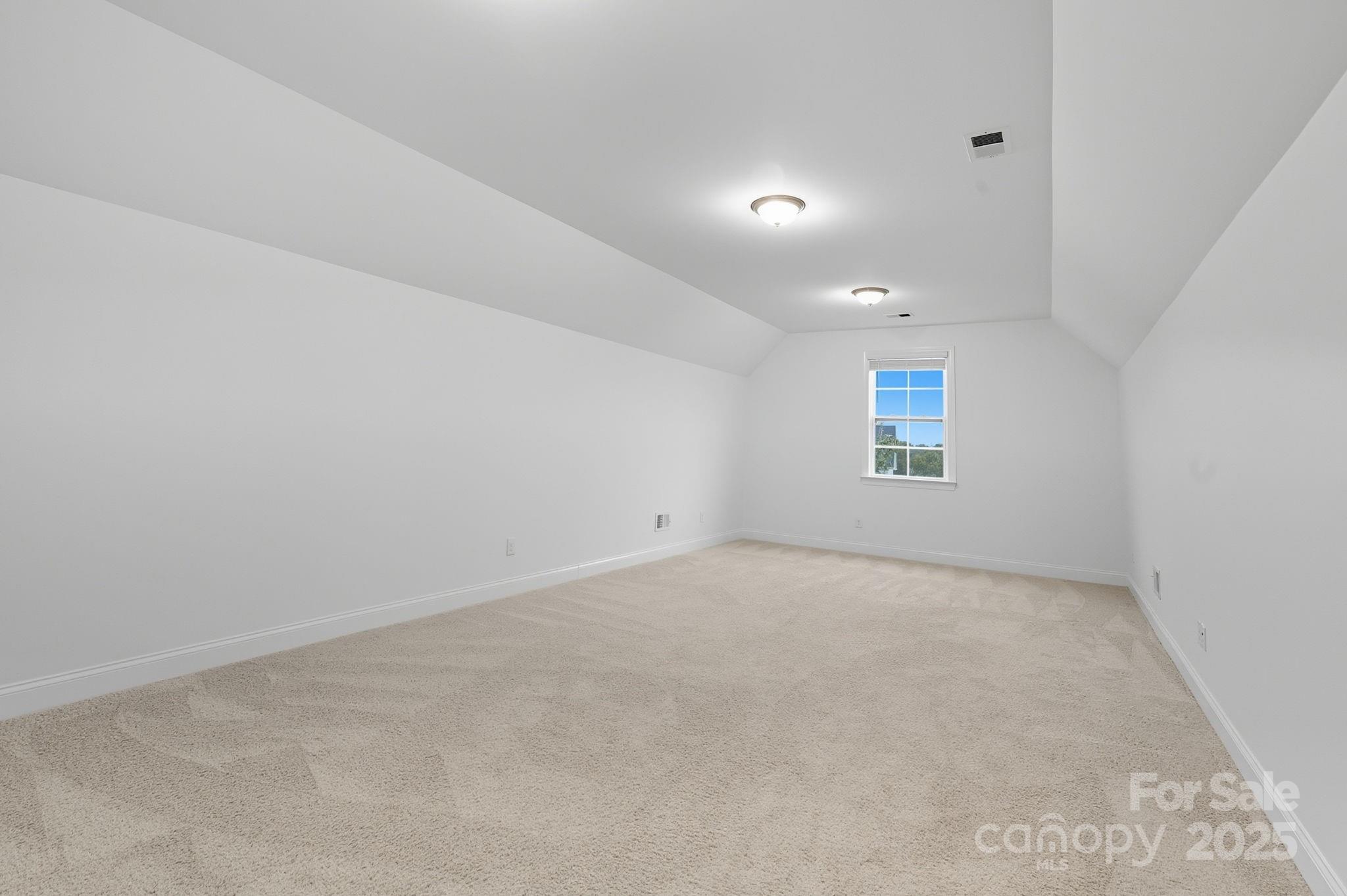 425 Cassia Court Tega Cay, SC 29708 - Photo 35 of 39 an empty room with a empty space and windows