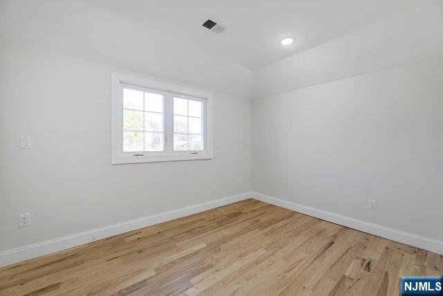 401 Franklin Street, Unit 2 Bloomfield, NJ 07003 - Photo 11 of 13 wooden floor in an empty room with a window
