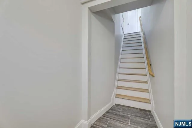 a view of a hallway with stairs