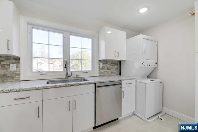 401 Franklin Street, Unit 2 Bloomfield, NJ 07003 - Photo 6 of 13 a kitchen with white cabinets and a window