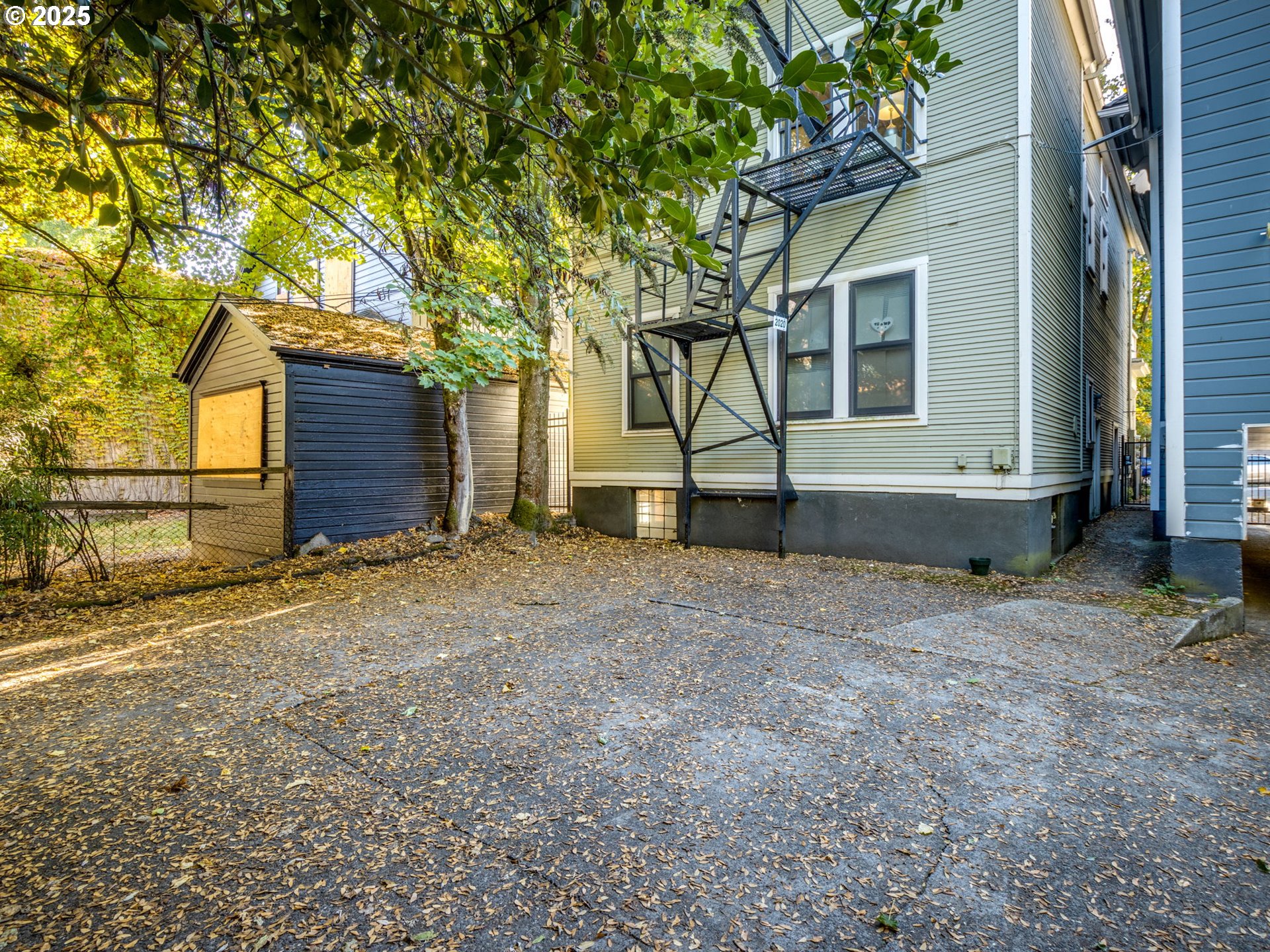 2137 Northwest Everett Street, Unit B Portland, OR 97210 - Photo 23 of 28 a house that has a tree in front of it