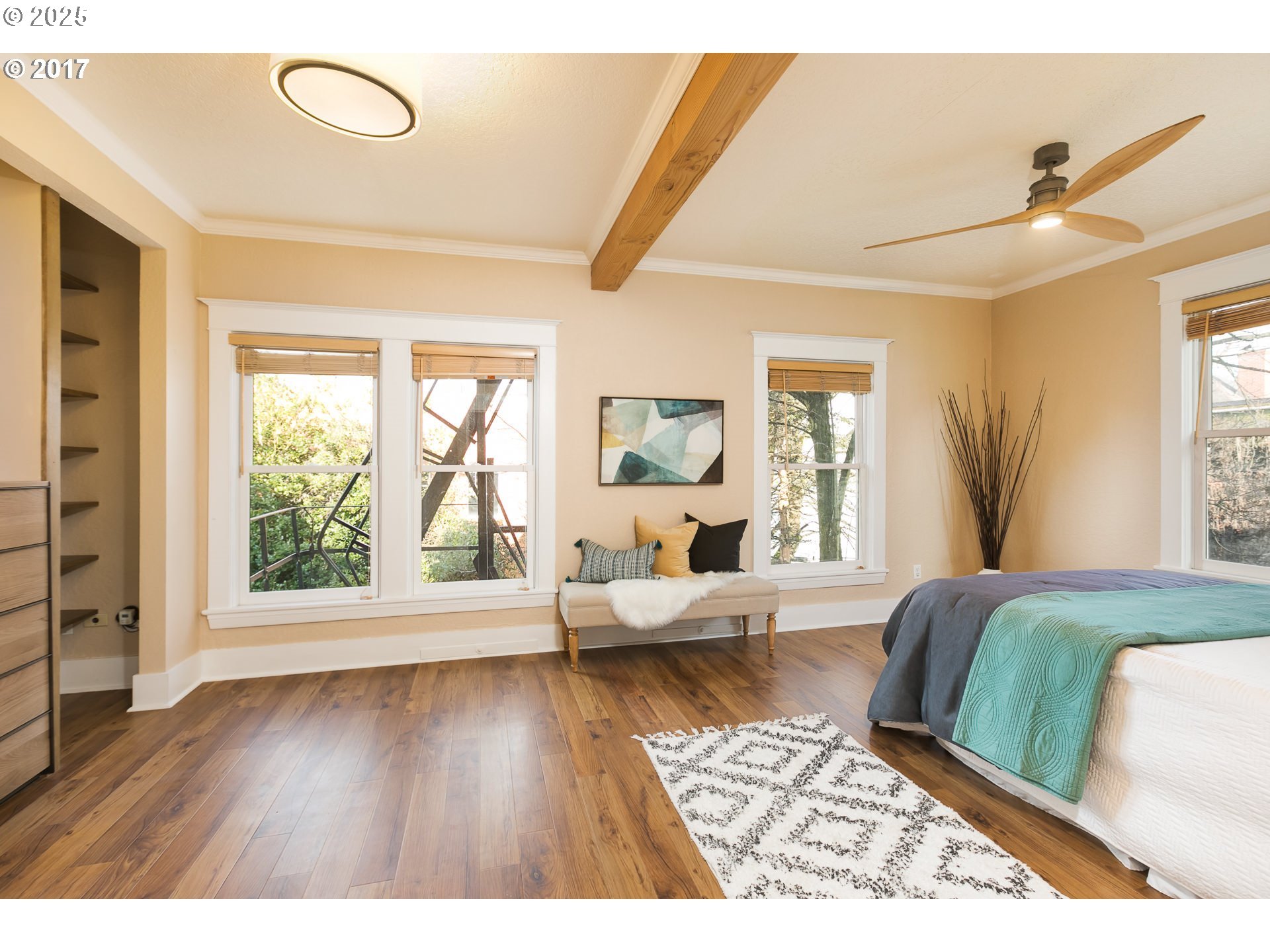 2137 Northwest Everett Street, Unit B Portland, OR 97210 - Photo 9 of 28 a living room with a bed furniture and a large window