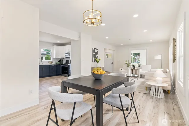 a dining room with furniture and wooden floor