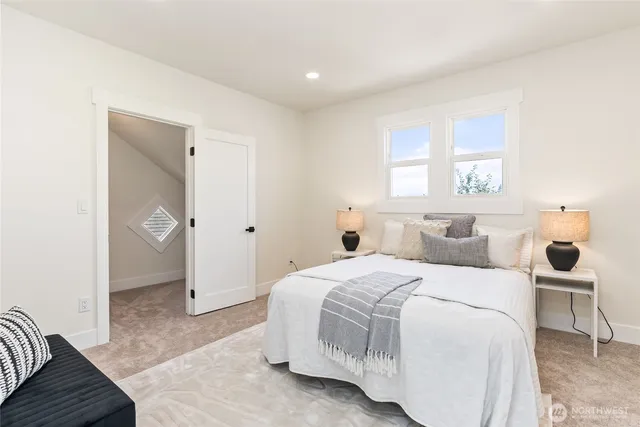 a bedroom with a bed and a couch