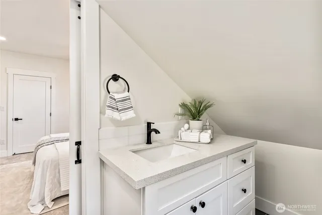 a bathroom with a sink and a mirror