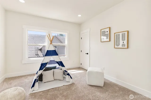 a room with furniture and air conditioner vent