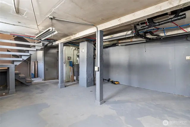 a view of an empty room with a storage