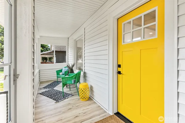 a view of porch with a door and chair