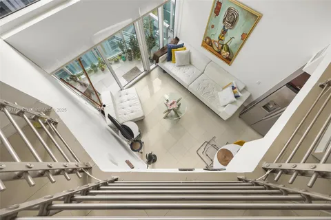 a view of staircase with white walls