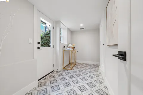 a view of a bathroom with a sink and a mirror
