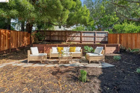 a view of a chairs and table in the patio