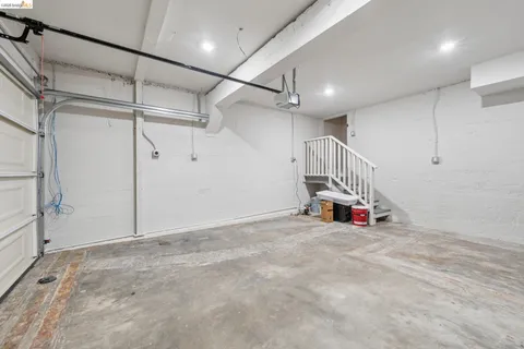 a view of a room with gym equipment and windows