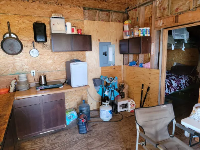 a kitchen with stainless steel appliances granite countertop a sink stove and wooden cabinets