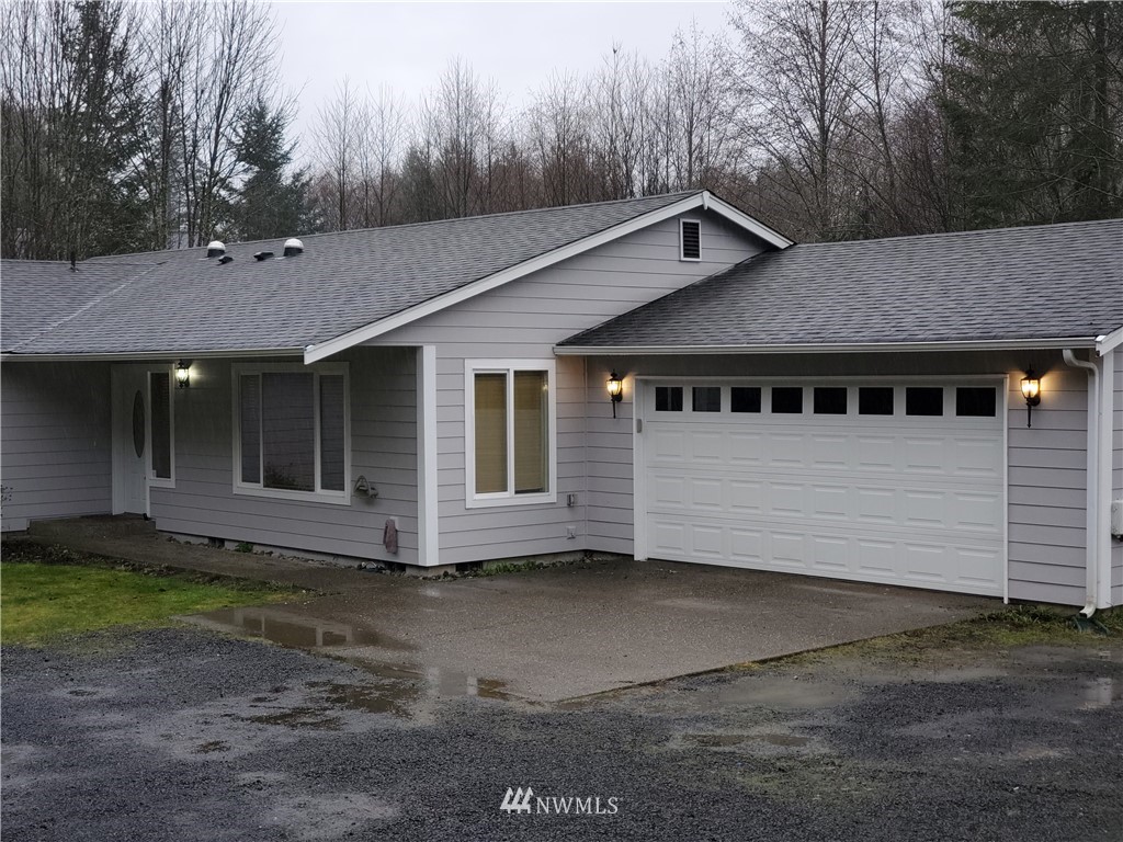 541 East Coulter Creek Road Belfair, WA 98528 - Photo 2 of 39 a view of a house with a yard