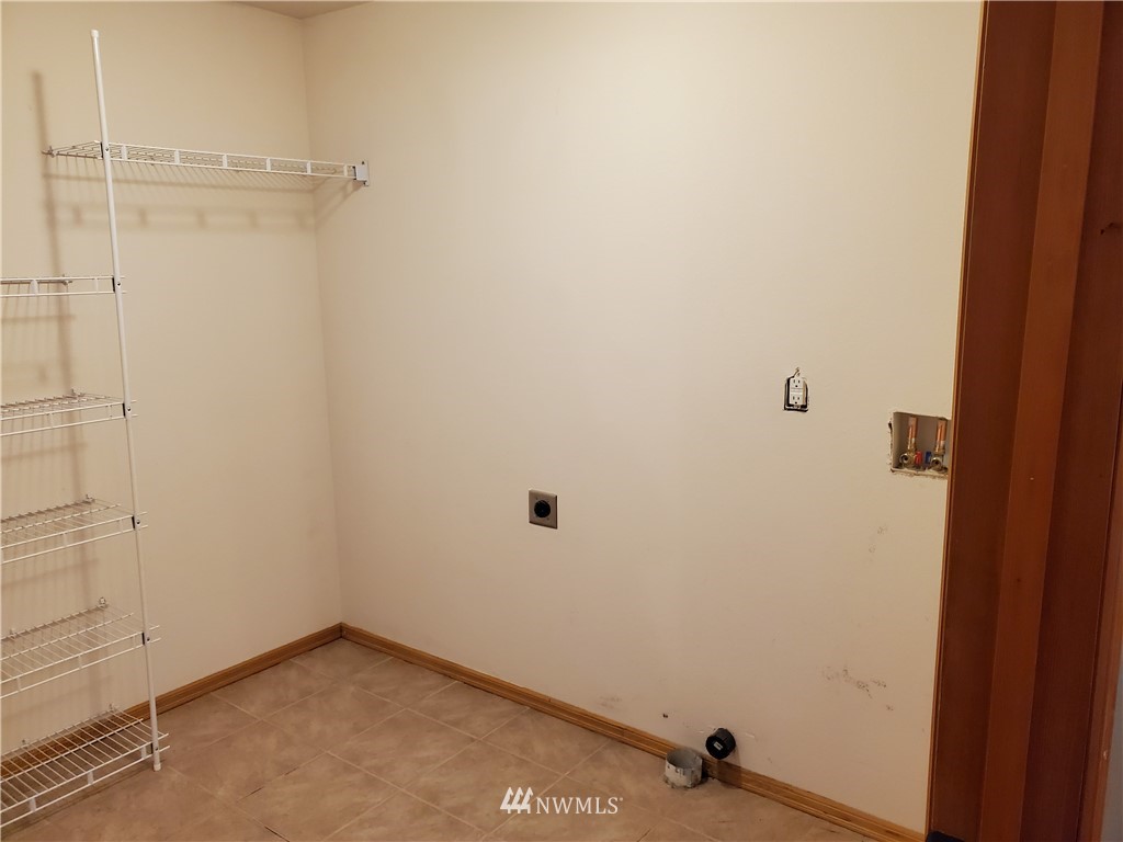 541 East Coulter Creek Road Belfair, WA 98528 - Photo 11 of 39 a view of a room with drop ceiling