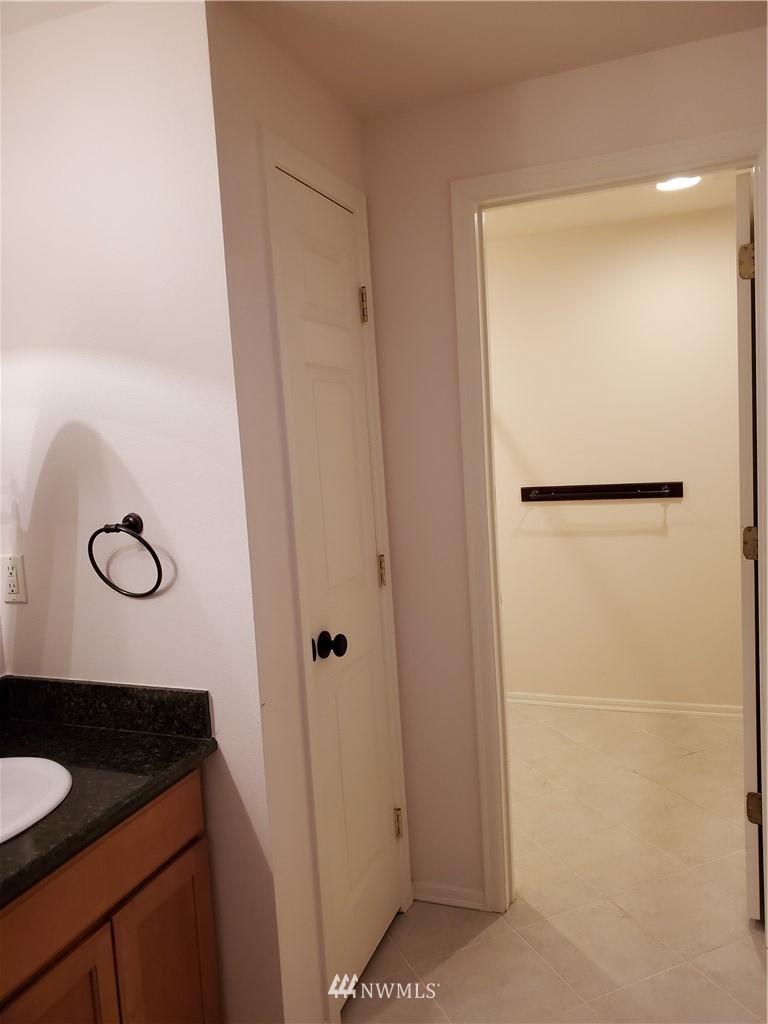 541 East Coulter Creek Road Belfair, WA 98528 - Photo 13 of 39 a bathroom with a granite countertop sink and a mirror