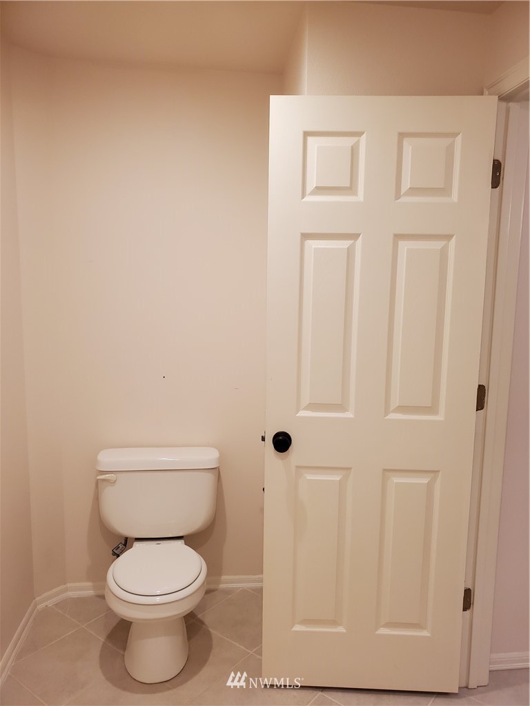 541 East Coulter Creek Road Belfair, WA 98528 - Photo 15 of 39 a white toilet sitting next to a shower