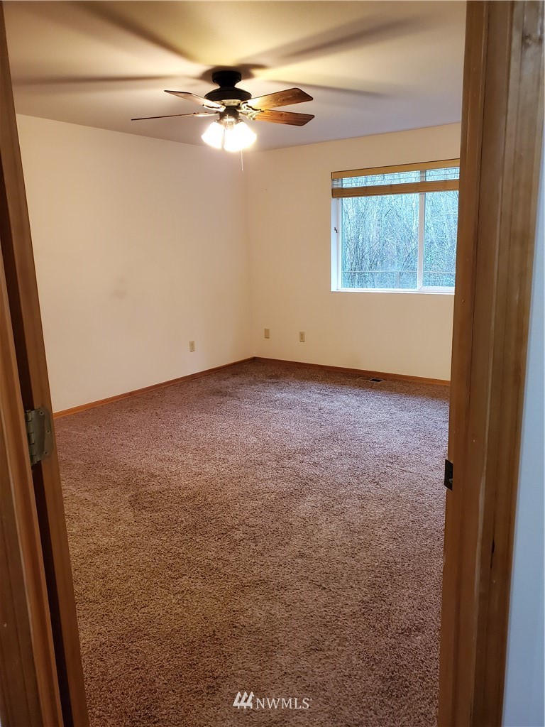 541 East Coulter Creek Road Belfair, WA 98528 - Photo 16 of 39 a view of a big room with carpet