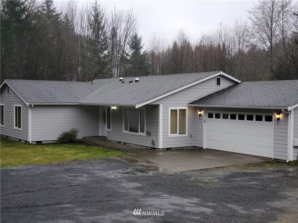 541 East Coulter Creek Road Belfair, WA 98528 - Photo 3 of 39 a view of a house with a yard