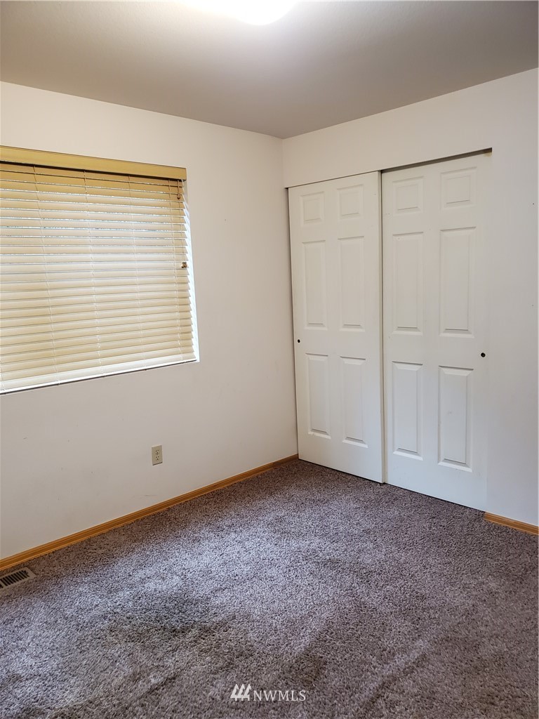 541 East Coulter Creek Road Belfair, WA 98528 - Photo 25 of 39 an empty room with a window